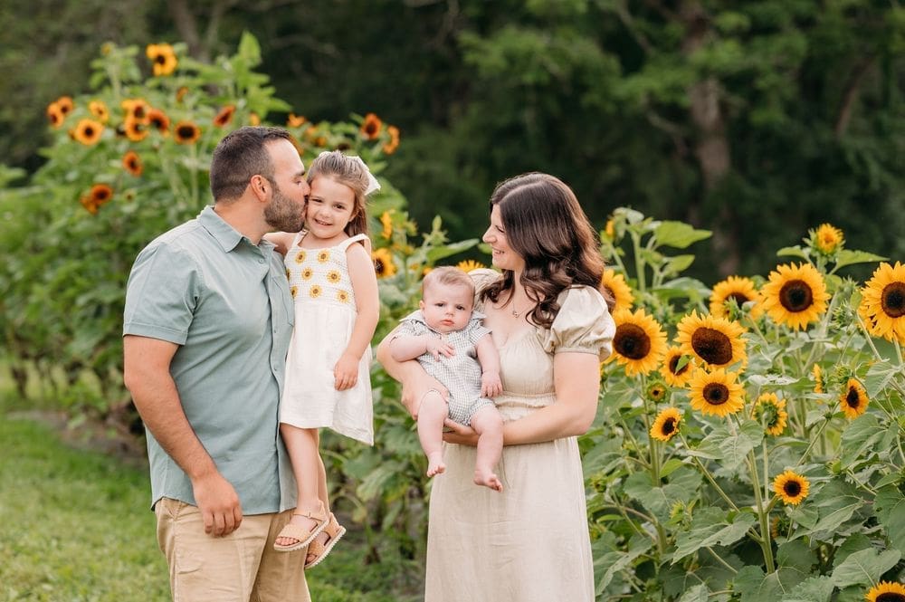 Family at their sunflower mini session at coppal house farm in Lee, NH.