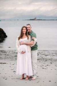 Couple at their beach maternity session at Great Island Common in Newcastle, NH