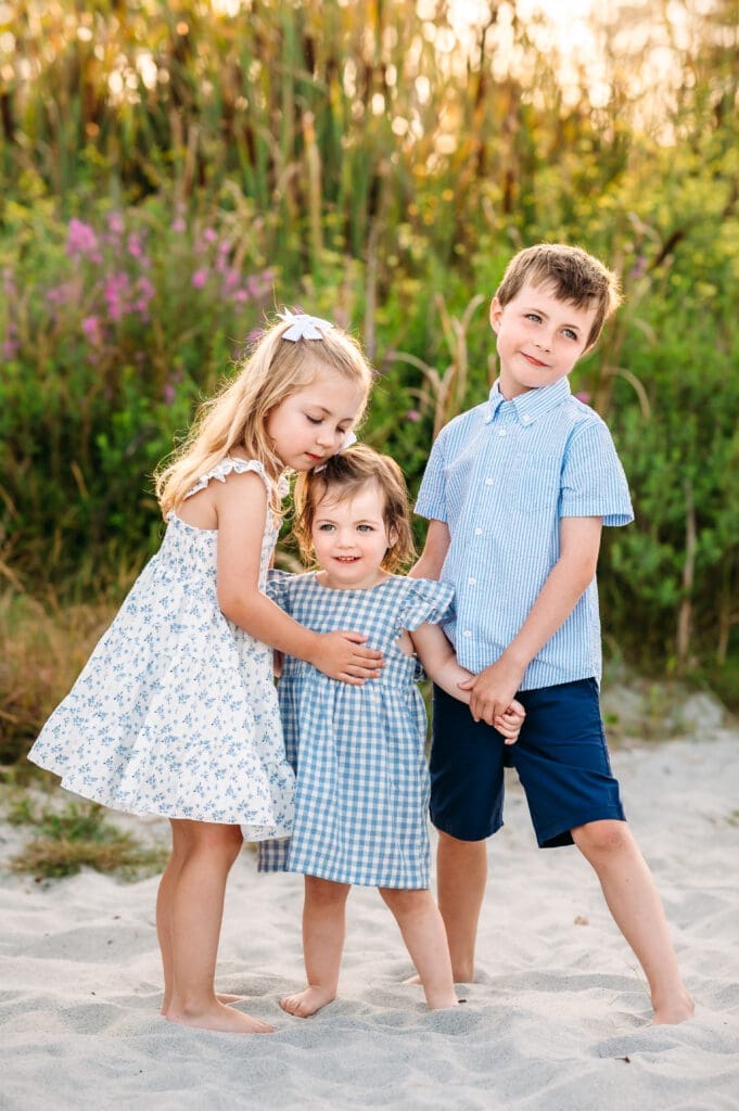 Siblings hugging at their great island common beach mini session.